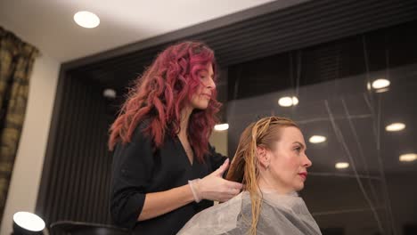 enjoy an exquisite professional hair coloring session at a toptier salon today a skilled stylist applies brilliant hair color in a vibrant salon atmosphere filled with beauty and creativity