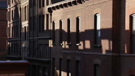 sunlight and shadows on historic brick buildings