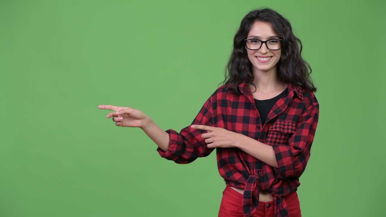 Young beautiful businesswoman showing something