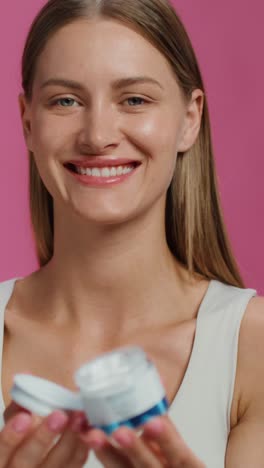 woman applying facial cream