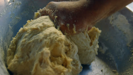 male chef kneading flour in kitchen 4k