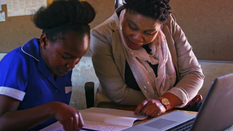 teacher helping schoolchildren in a lesson at a township school 4k