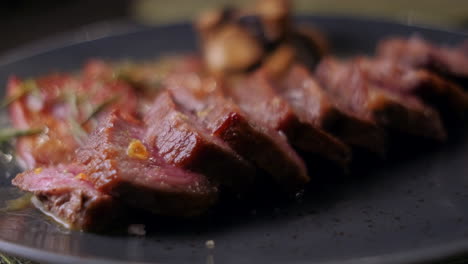 close-up of a delicious meal containing slices of meat and vegetables in the background, spanish meal made in a restaurant