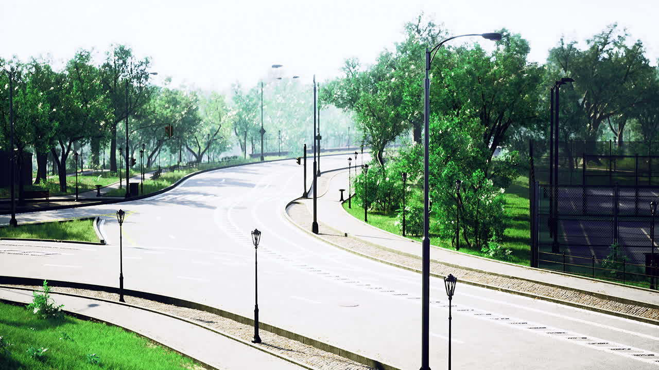 Winding road lined with trees in a serene park on a sunny day