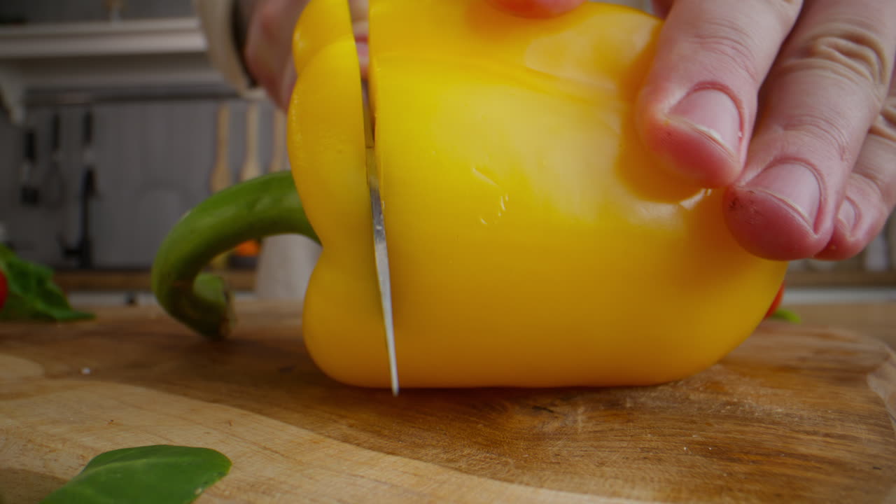 Chef Chopping a Yellow Pepper