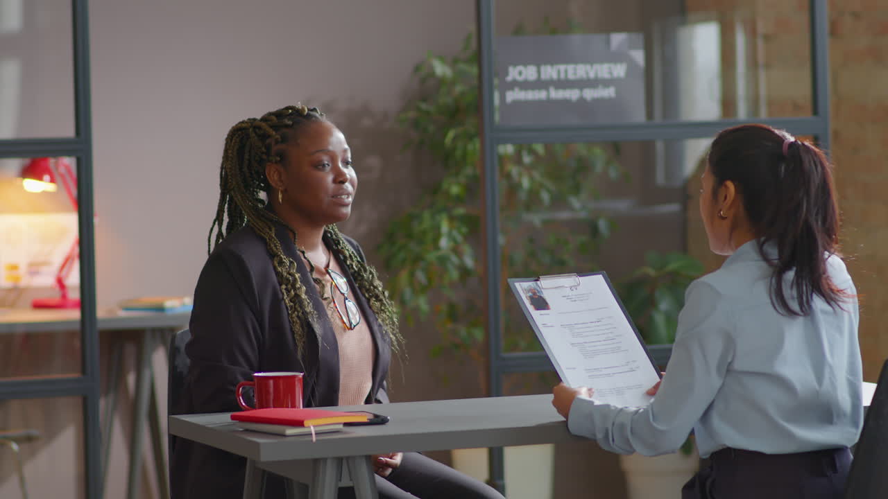 African American Female Candidate Having Job Interview with HR Manager