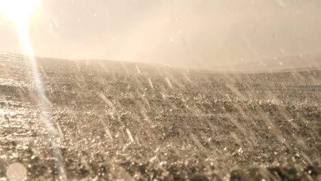 a spray of water can be seen coming off the back of the wave