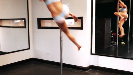 pole dancer practicing pole dance
