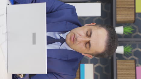 Vertical-video-of-Businessman-sad-seeing-his-failure-on-laptop.