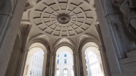 grand interior architecture of the ajuda palace featuring intricate arches and sculptures