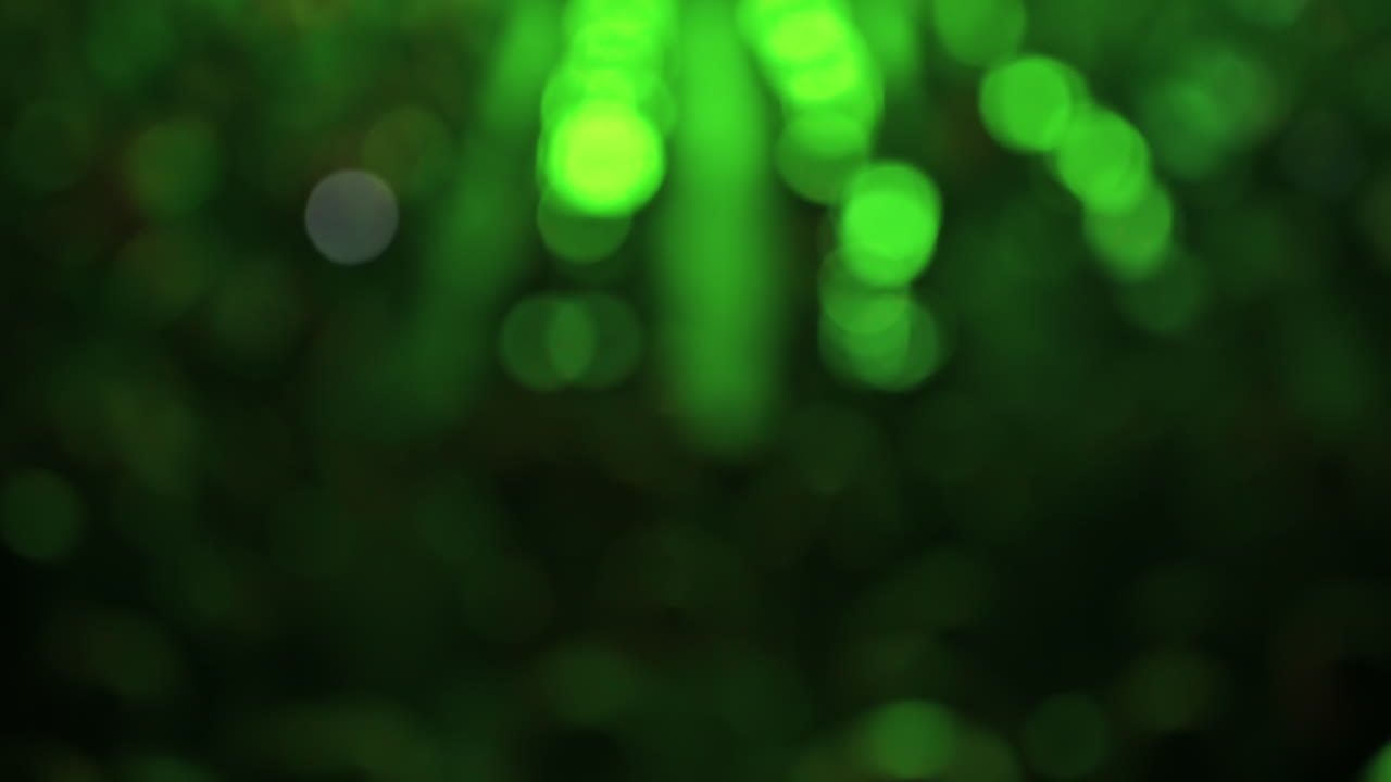 Blurred and bokeh night scene, people watching football in a public place