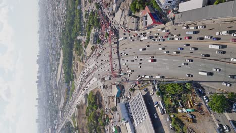 aerial view of busy highway traffic in a city