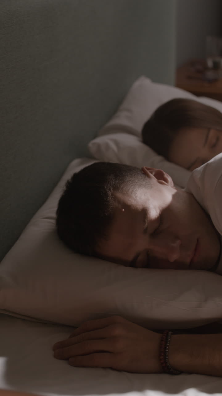 Couple Sleeping in Bed
