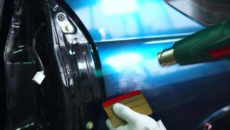 car body repair with heat gun and plastic repair tool