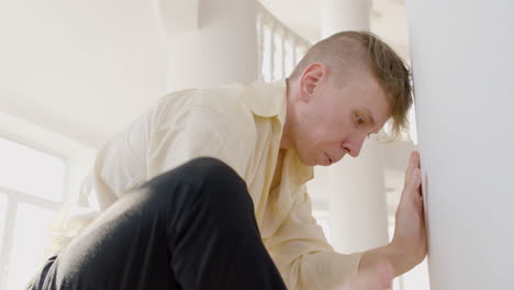 close up view of man dancer dancing leaning on a column in the studio 1