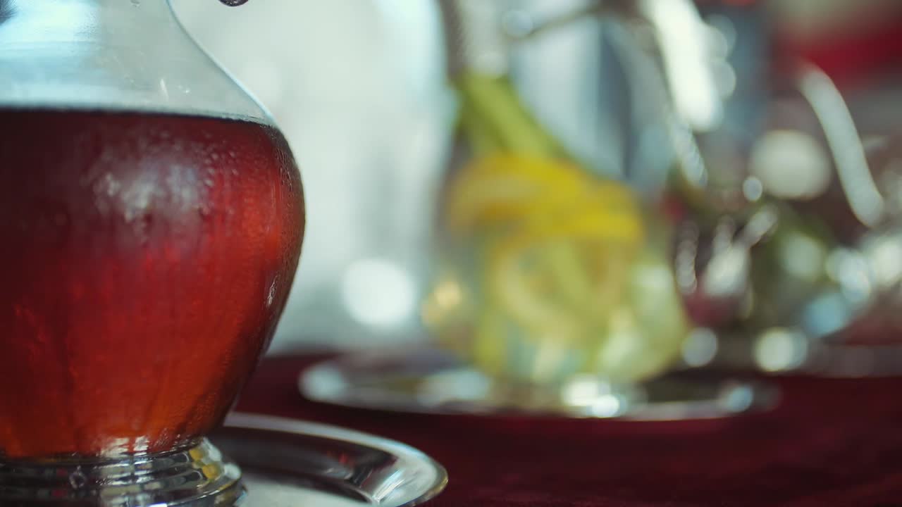 fresh juices in the tray with silver handles. focus transition. slow motion.