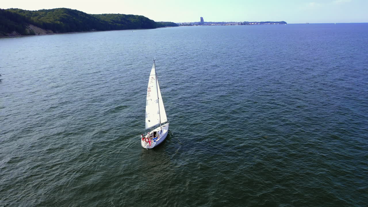Aerial shot of drone flying above the ship sailing on the Baltic sea near Gdynia