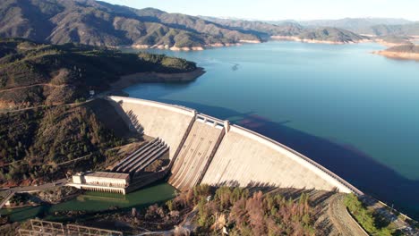 gorgeous drone pan of shasta dam, hydroelectric plant