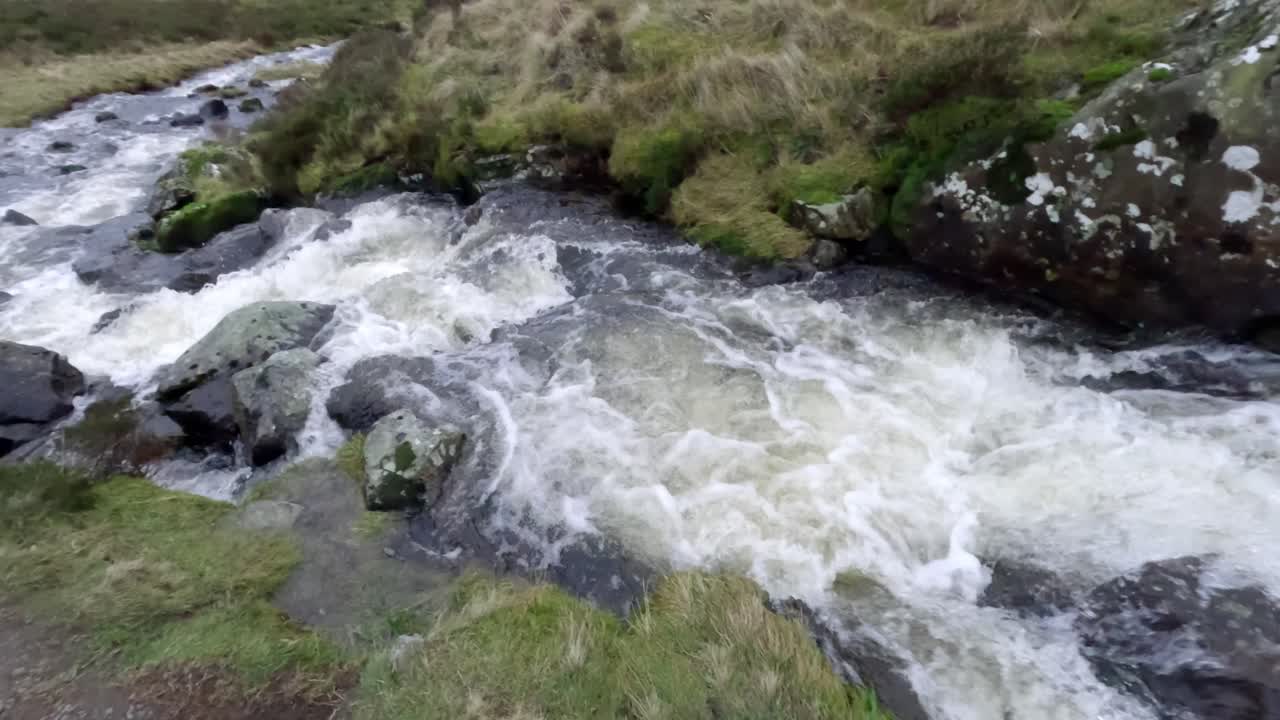 Fast-flowing glacier river beside the picturesque walkway of the Gray Mare's Trail