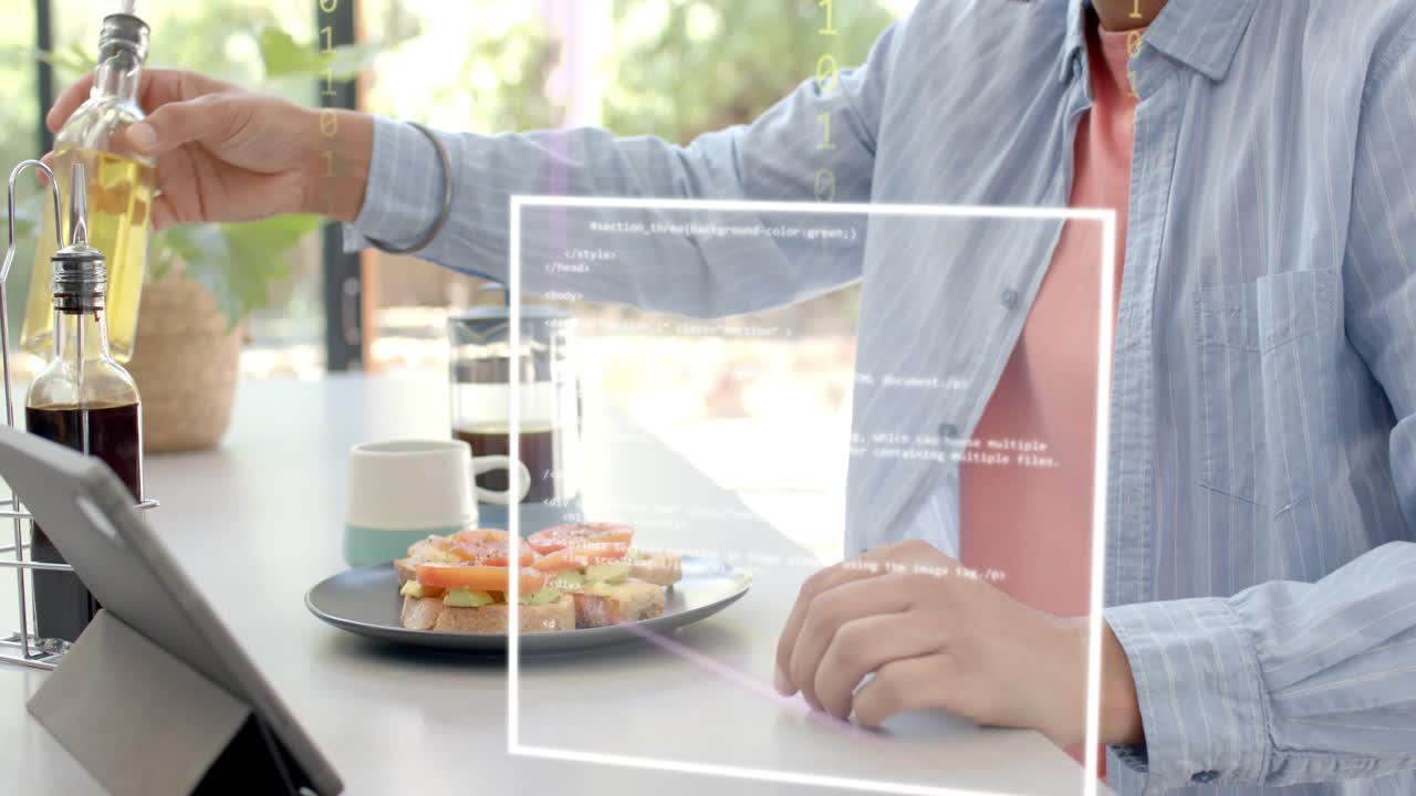 Man sitting kitchen table by window drizzling oil, coating sandwich, causing AR HUD binary tech