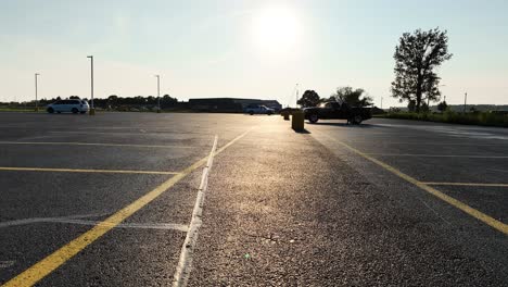 sunshine reflecting off of a blacktop parking lot