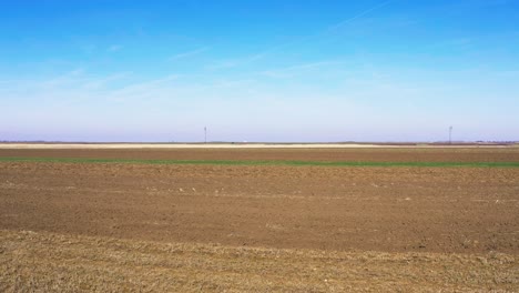 aerial view drone footage of plowed agricultural field
