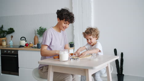 mother and son baking cookies