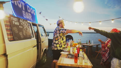 food truck seller giving high five to friends and turning off lights