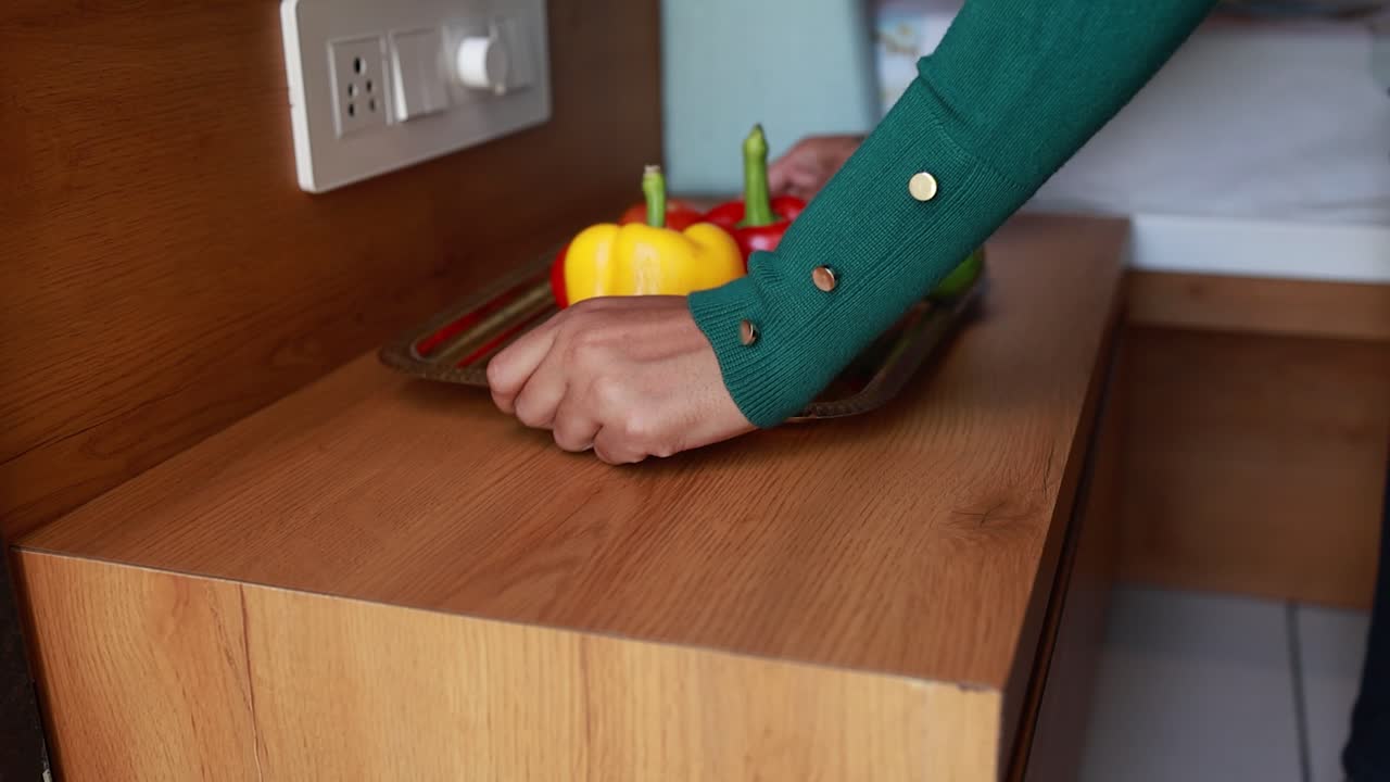 woman taking a vegetables plat on the wooden board