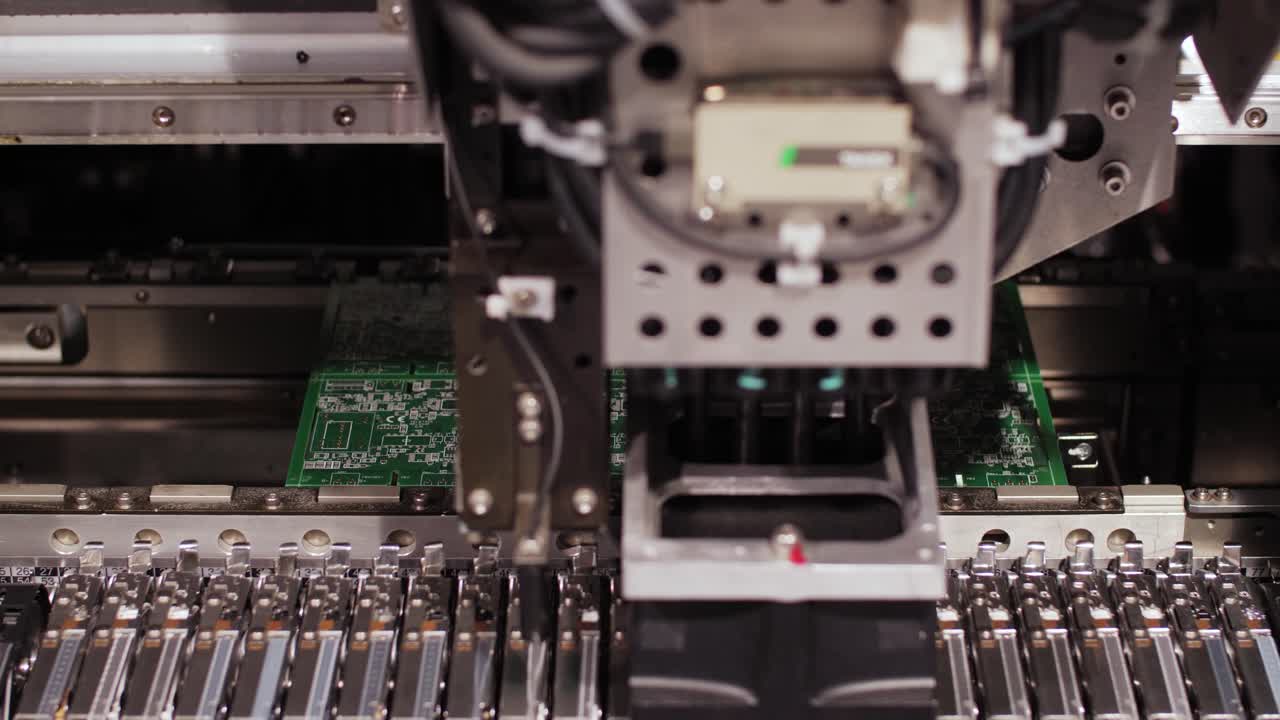 Close-up of a pick-and-place machine assembling a PCB, showcasing modern manufacturing precision
