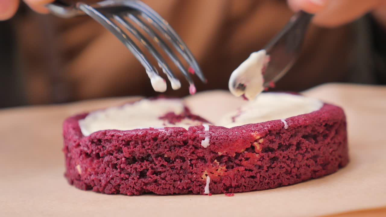 Cutting a red velvet cake