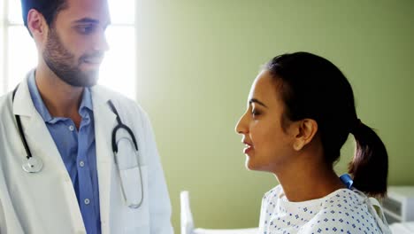 Doctor-examining-patients-neck-in-the-hospital