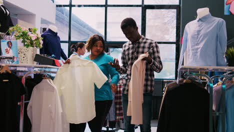 couple checking stylish merchandise