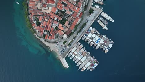 a top down, aerial view over korcula old town at sunrise