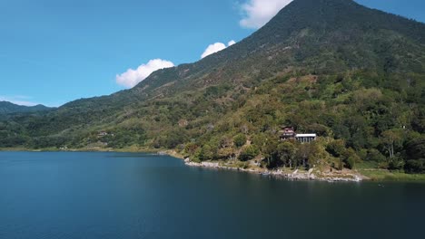 drone aerial landscape wide view of a volcano and lake atitlan, guatemala