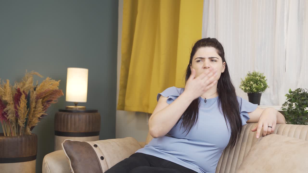 The woman who smells bad odor is disturbed and disgusted.