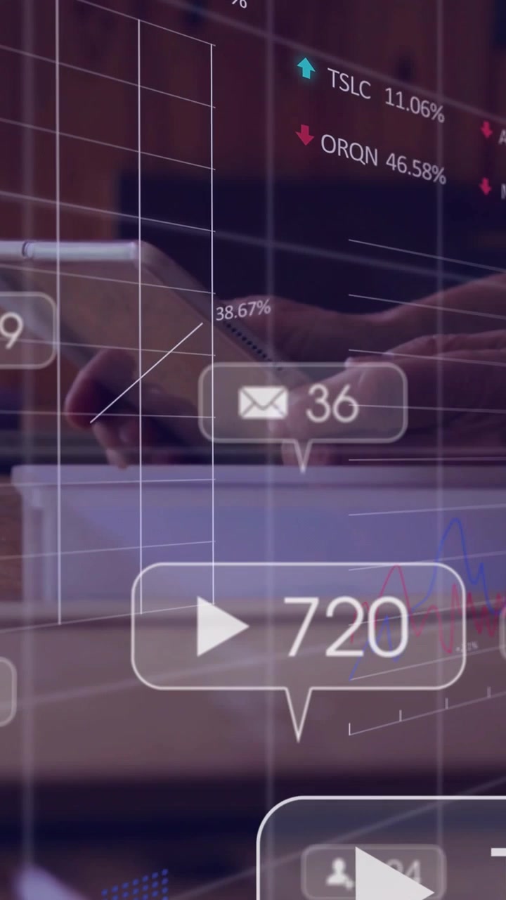 Vertical video: Man tapping tablet, plays and inbox updating, charts and tickers moving for finance