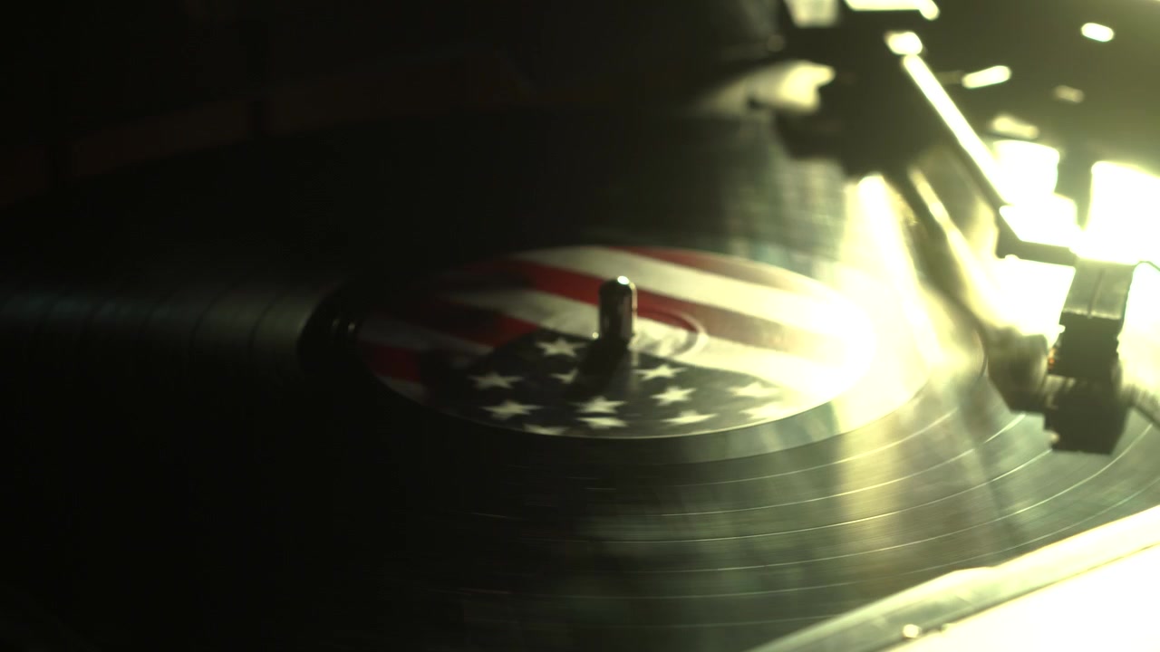 Retro Music Playback, Spinning Vinyl Record Album With American Flag Sticker and Sun Reflection