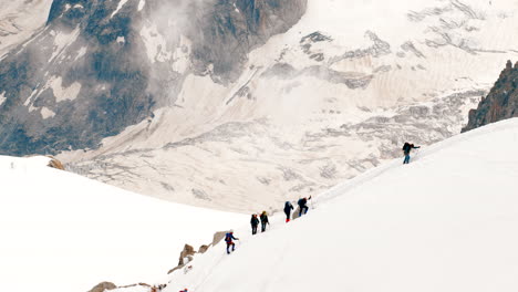 alpinists-climbing-mountain-in-good-sunny-conditions