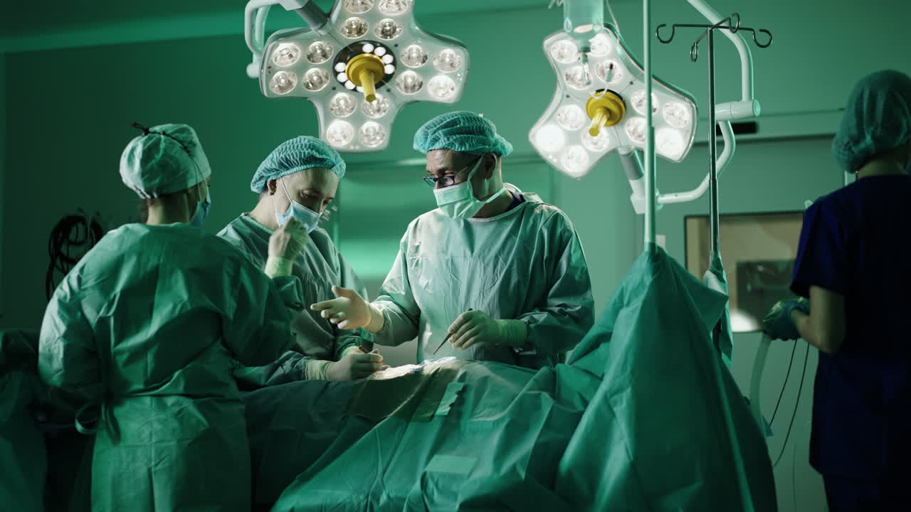 Surgical team performing an operation in a sterile operating room