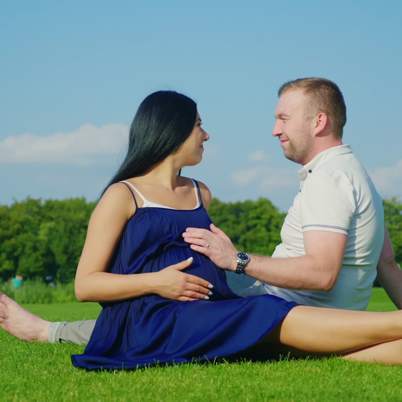 A Pregnant Woman With Her Husband Considered Toys For Their Unborn Baby