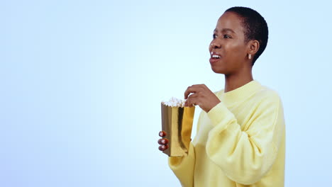 African-woman,-popcorn-and-laugh-in-studio