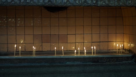 candles burning in a church