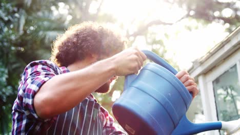 Gardener-watering-plants-with-watering-can