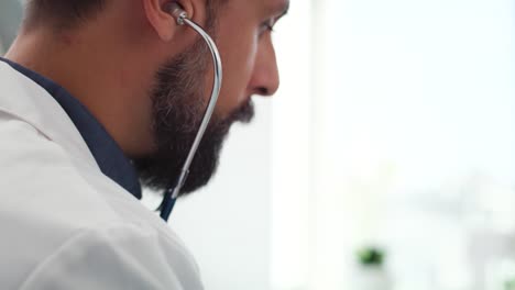 handheld view of doctor examining his patient in doctor’s office