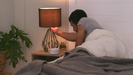 bedroom with person in bed