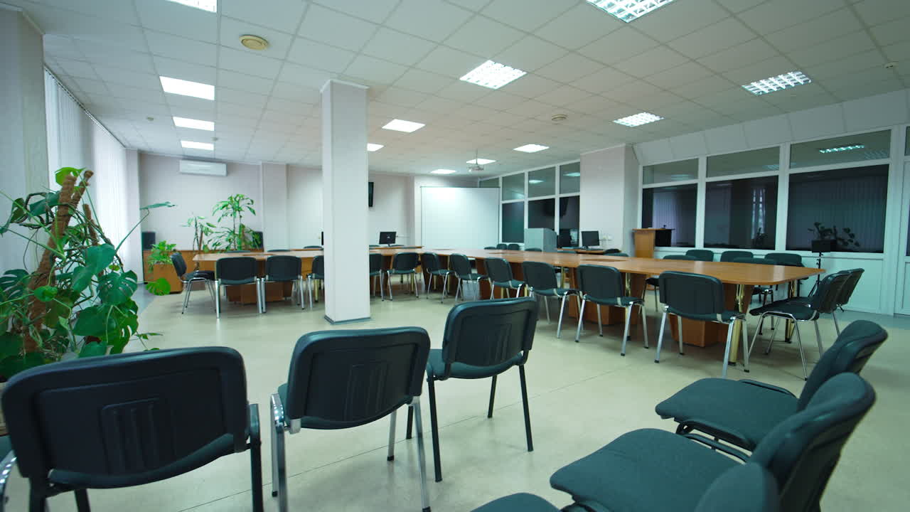Large hall for medical conferences and symposiums. Meeting room for healthcare professionals in modern hospital.