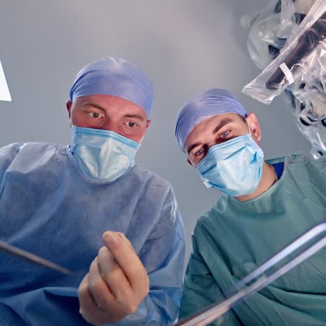 team of doctors over patient