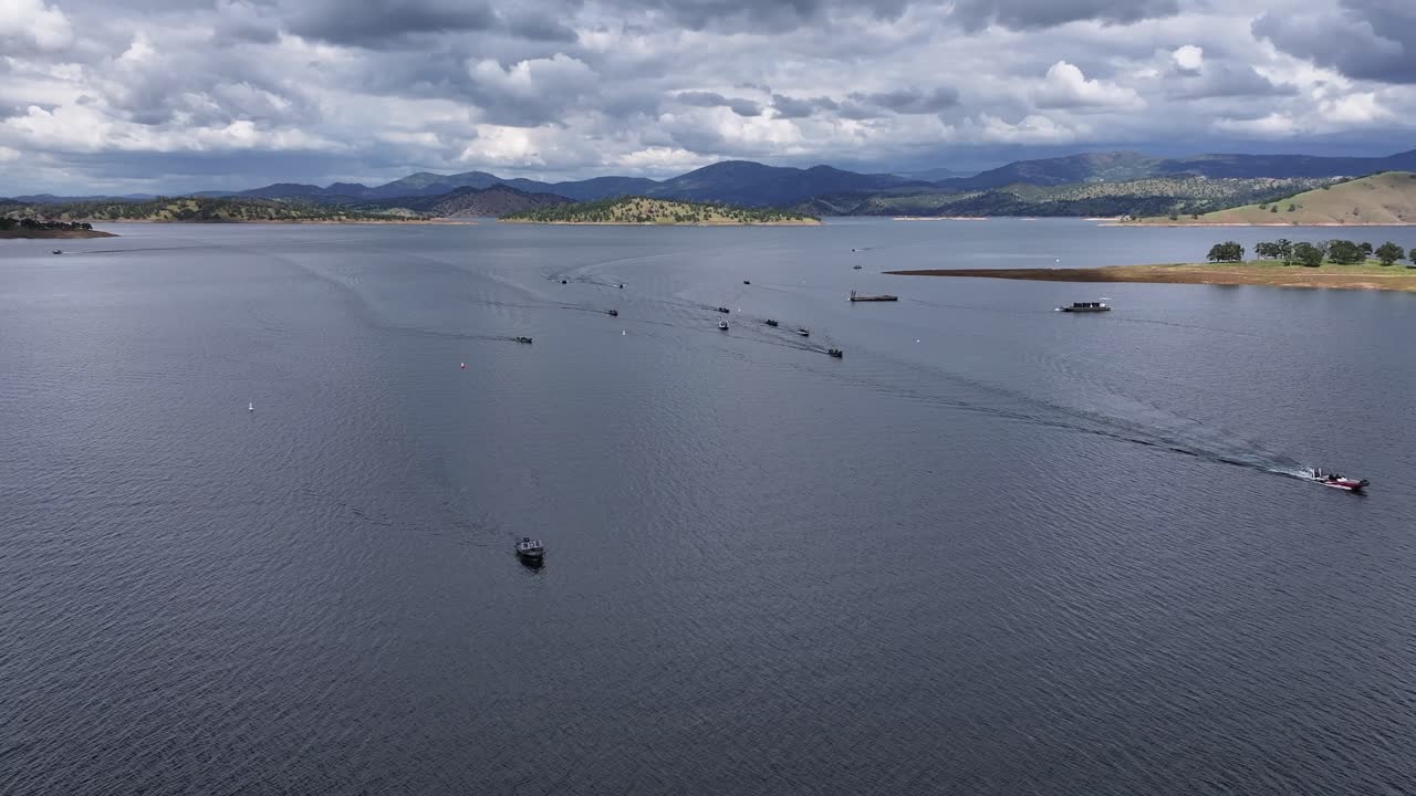 Aerial view of a bass boat fishing tournament at Don Pedro Lake California