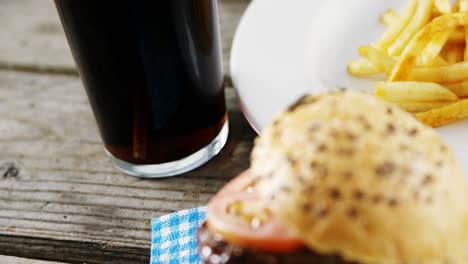 Snacks-and-cold-drink-on-wooden-table